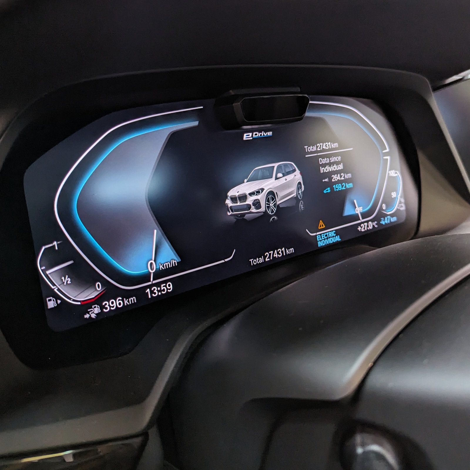 BMW eDrive instrument panel showing electric driving mode and battery charge information.
