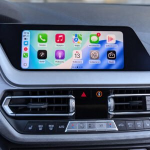 Apple CarPlay with a light background and Polish labels on a BMW display